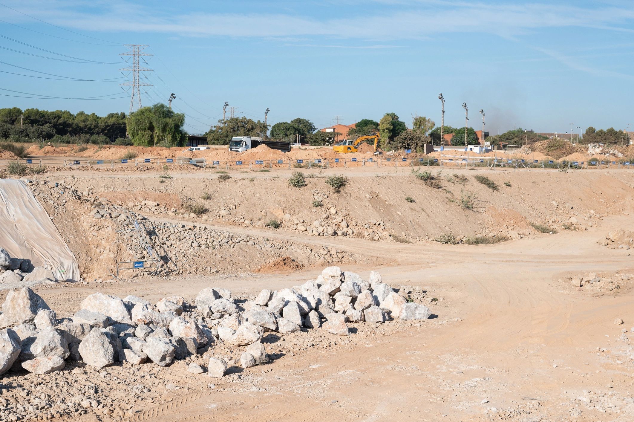 Dump truck and excavator working on an earthmoving site